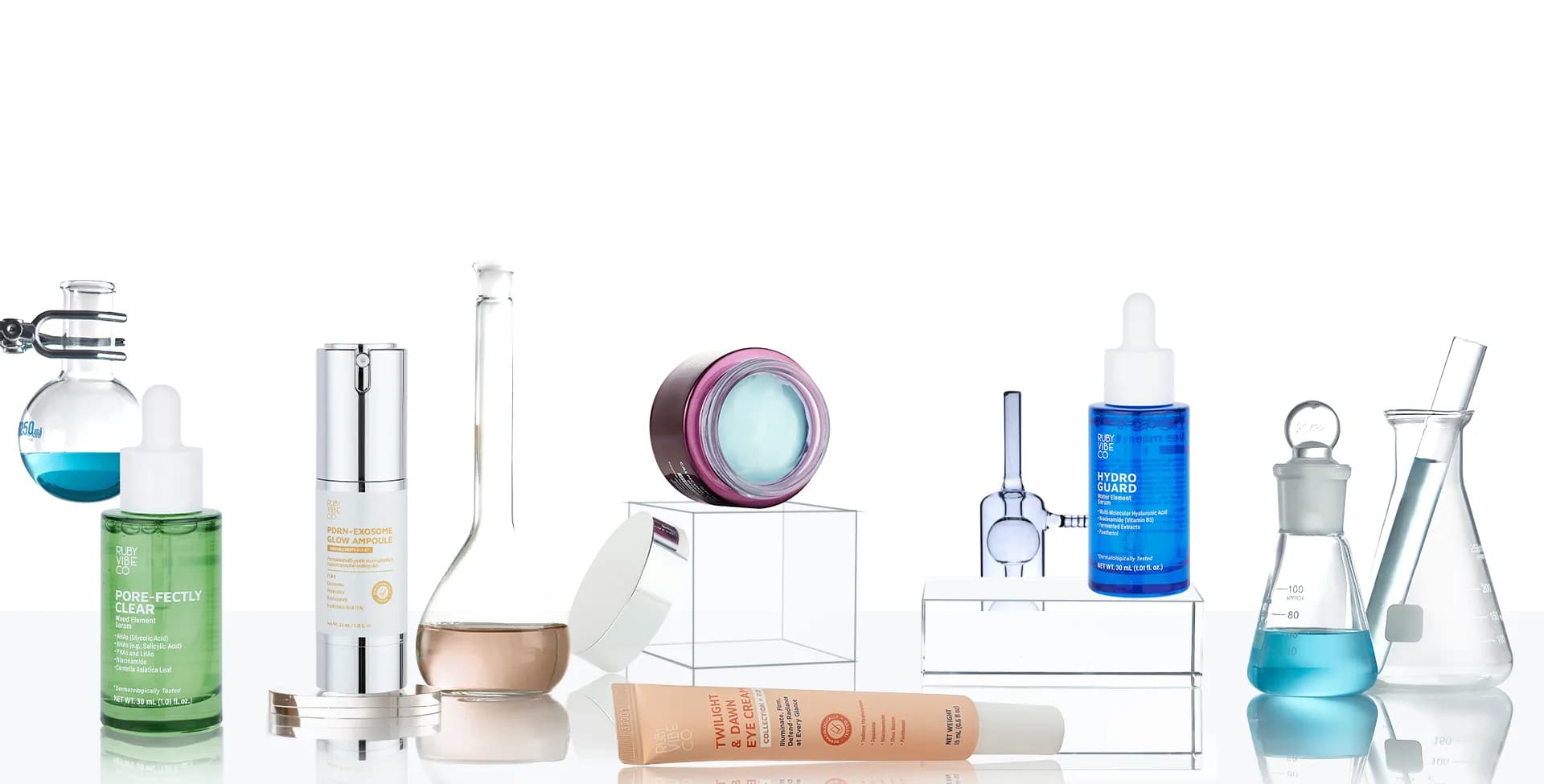 Ruby Vibe Co science-backed skincare products displayed with chemistry glassware