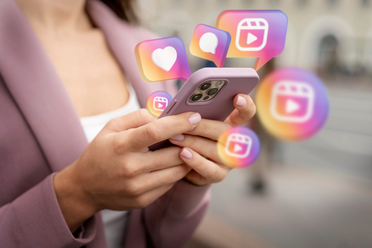 Ruby Vibe Co creator holding phone with Instagram notifications, featuring social media engagement and UGC content creation