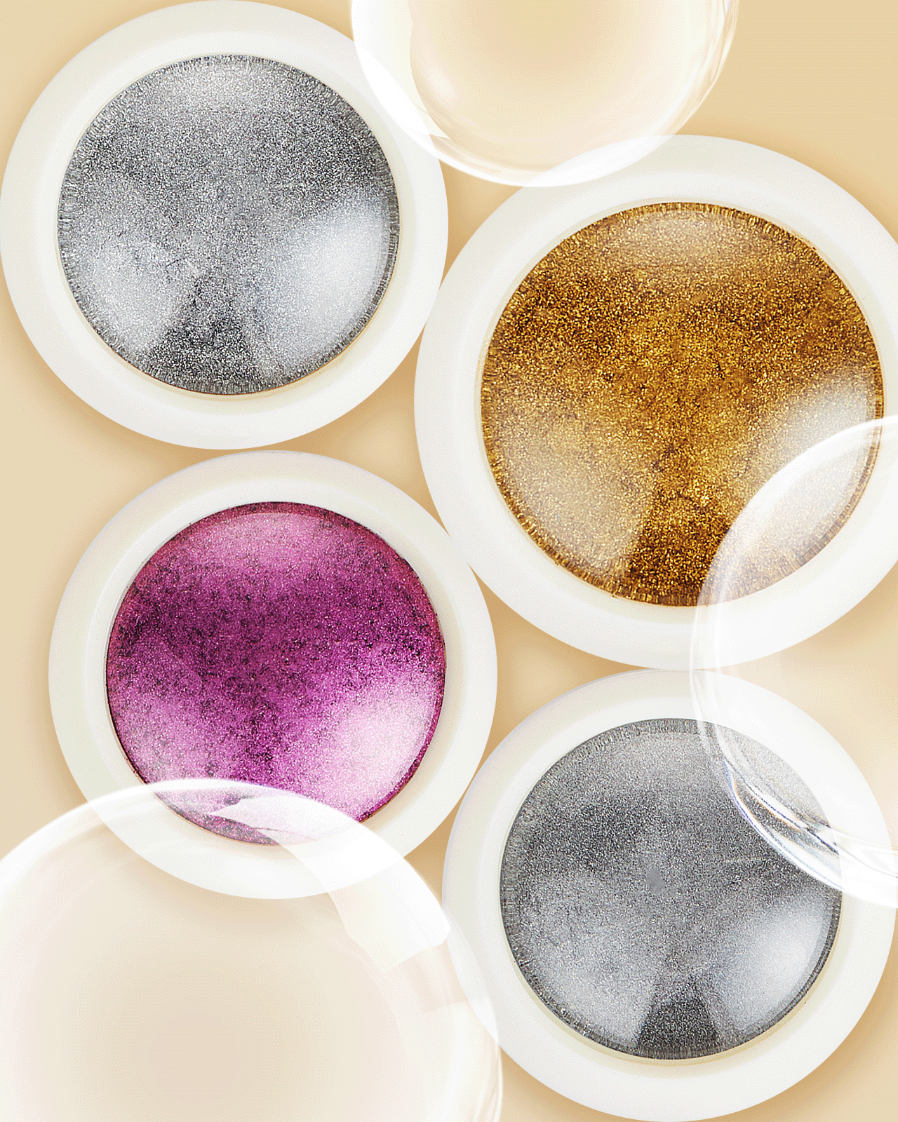 A close-up of four 'Holo Chrome Fashion Set' pots, showcasing different holographic and chrome powders for creating shiny, trending gel nail art finishes.