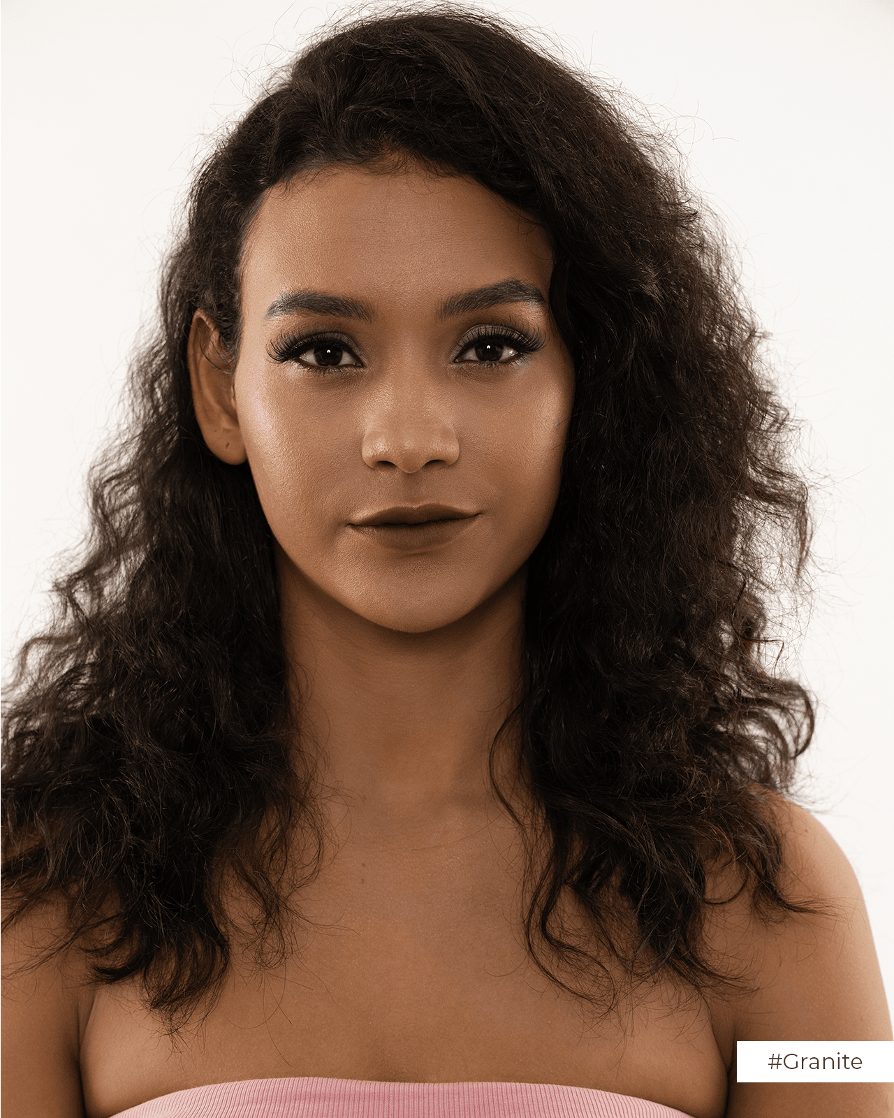a girl painting her eyebrown with pencil
