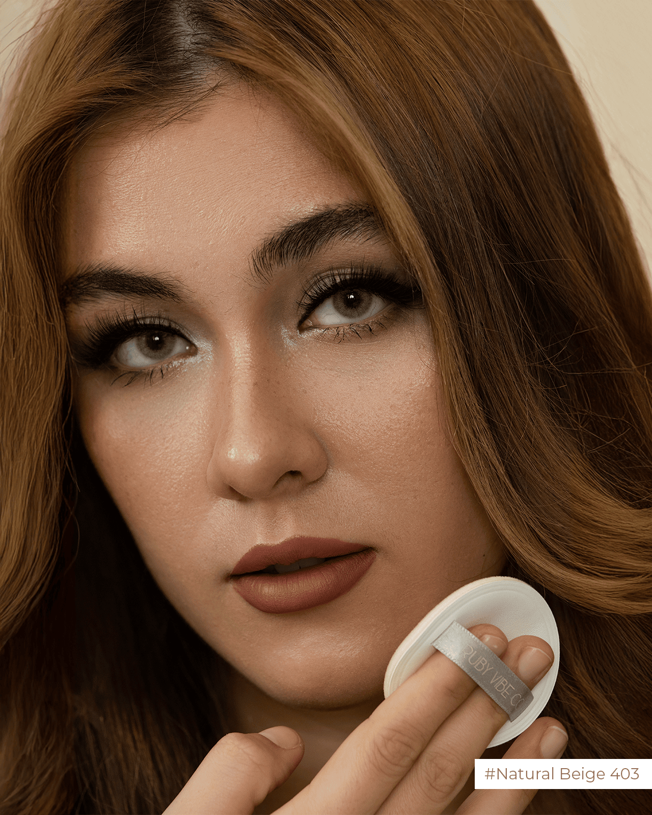 a woman are applying blush on her face