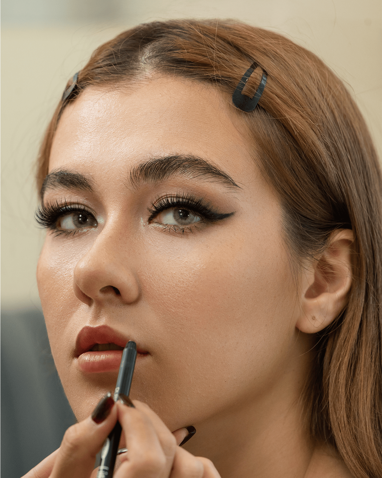 a woman makeup look with aesthetic hair accessories.