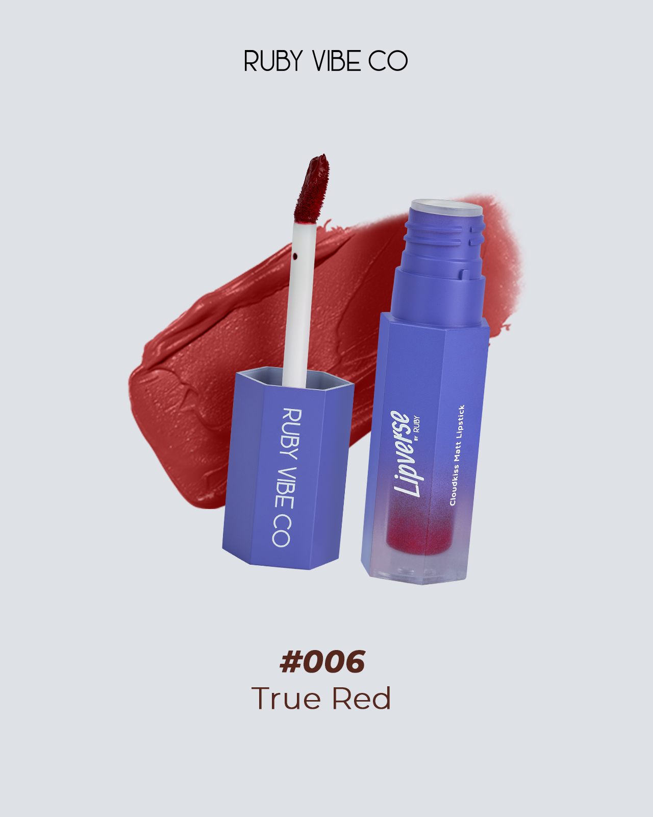 A product shot of the Ruby Vibe Co "Lipverse Cloudkiss Matt Lipstick" in the shade "#006 True Red." The photo features the lipstick tube and applicator next to a vibrant swatch of the red color, highlighting the product itself.