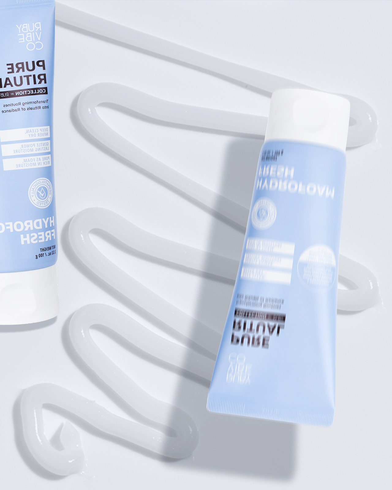 A product shot of 'Ruby Vibe Co Pure Ritual' cleansers, showcasing different types of cleansers, such as foaming and gel, to meet various skincare needs.