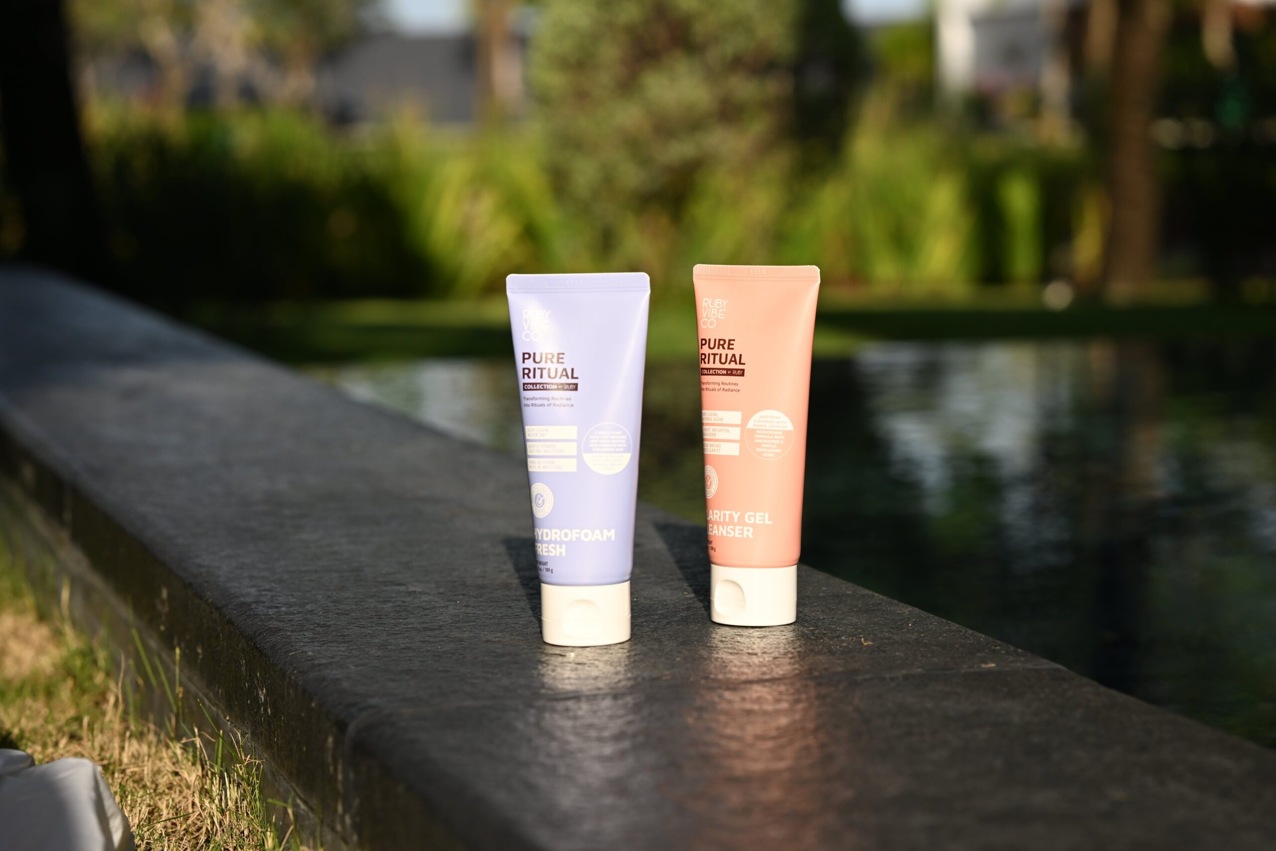 Two tubes of 'Pure Ritual' cleansers in light purple and peach, representing different options for finding the perfect cleanser for various skin types.
