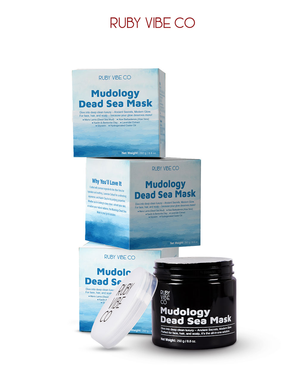 A product shot of Ruby Vibe Co's Mudology Dead Sea Mask, featuring stacked blue and white boxes and an open black jar showing the dark mask inside.