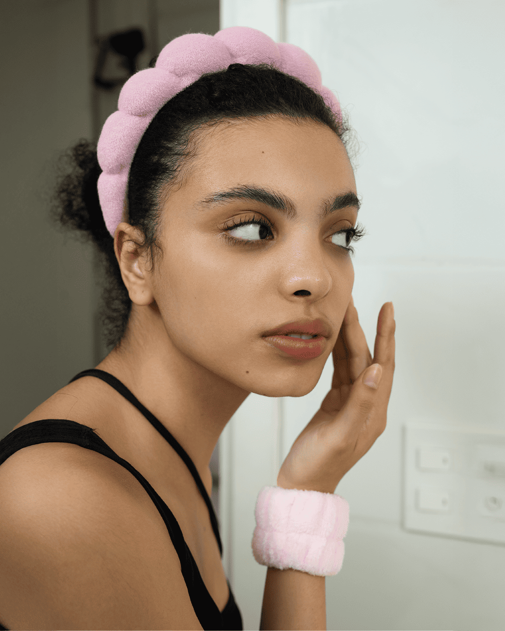 A Ruby Vibe Co facial steamer on a bathroom counter