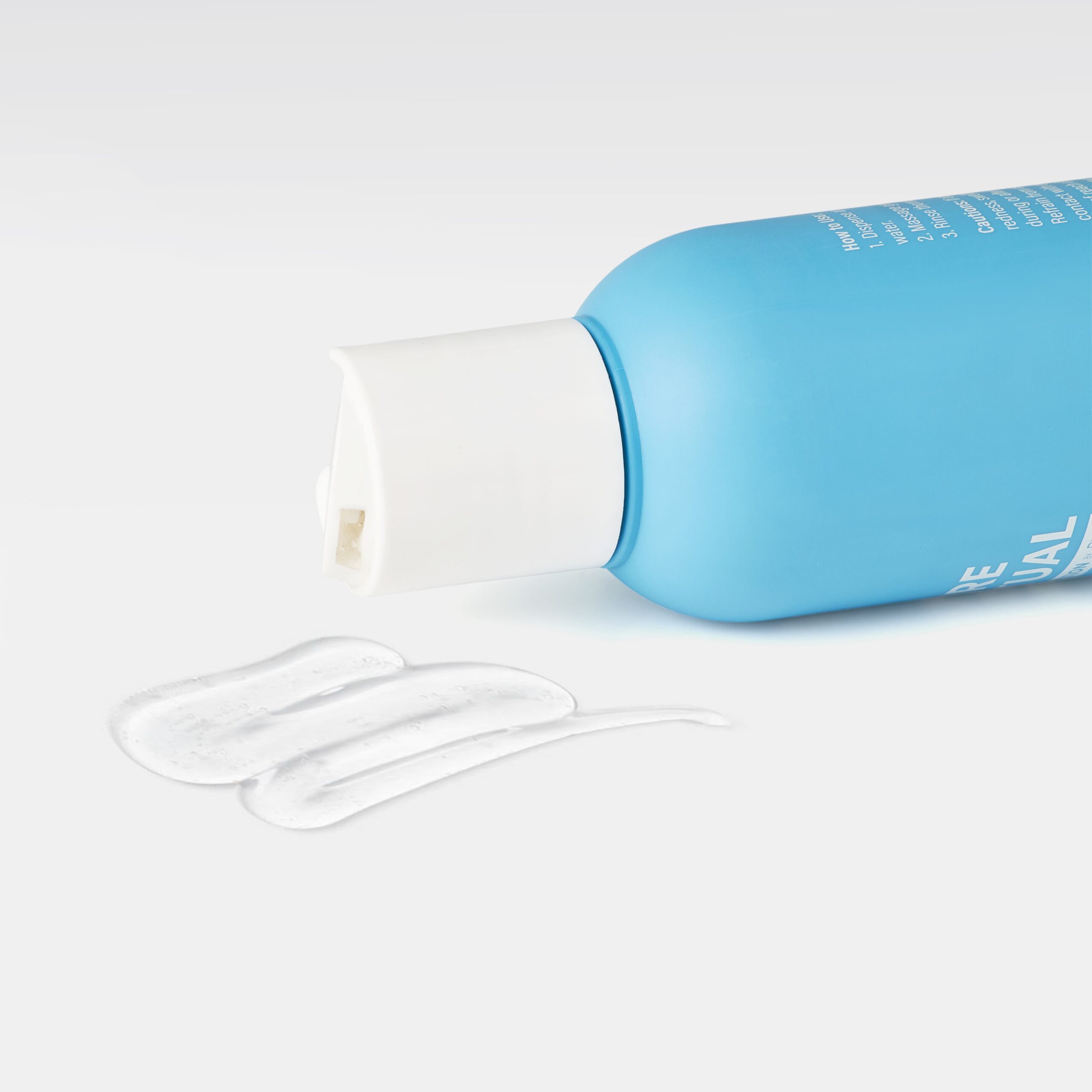 A streak of gel from a body cleanser bottle, demonstrating the texture of the product which contains key ingredients for back acne treatment.