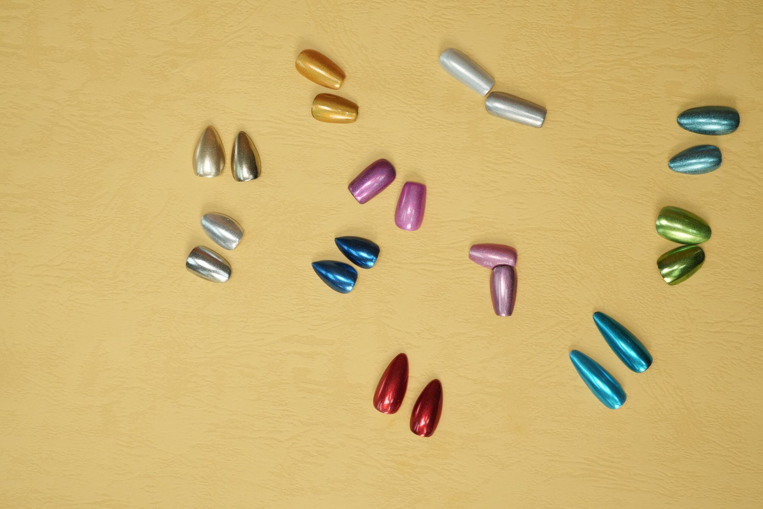 A close-up demonstrating a scattered holo finish, where fine holographic powder creates a beautiful, dispersed rainbow sparkle over the nail.