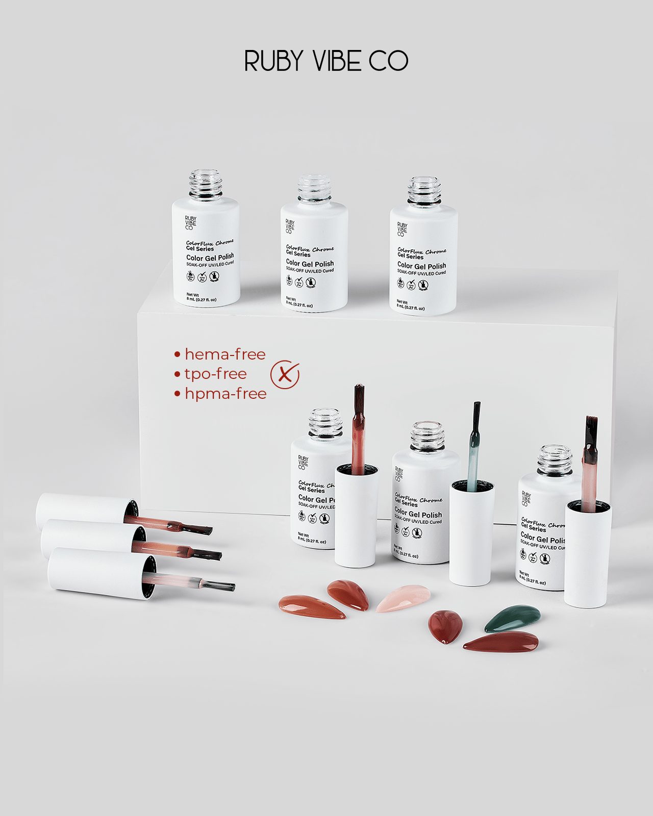 DIY Fall Nails at Home: A collection of Ruby Vibe Co. gel polishes, including a range of earthy and soft colors. Several bottles are open, with their brushes resting nearby, and small artificial nails painted with the shades are displayed, offering a guide to the tools and colors needed for a DIY cozy fall manicure.