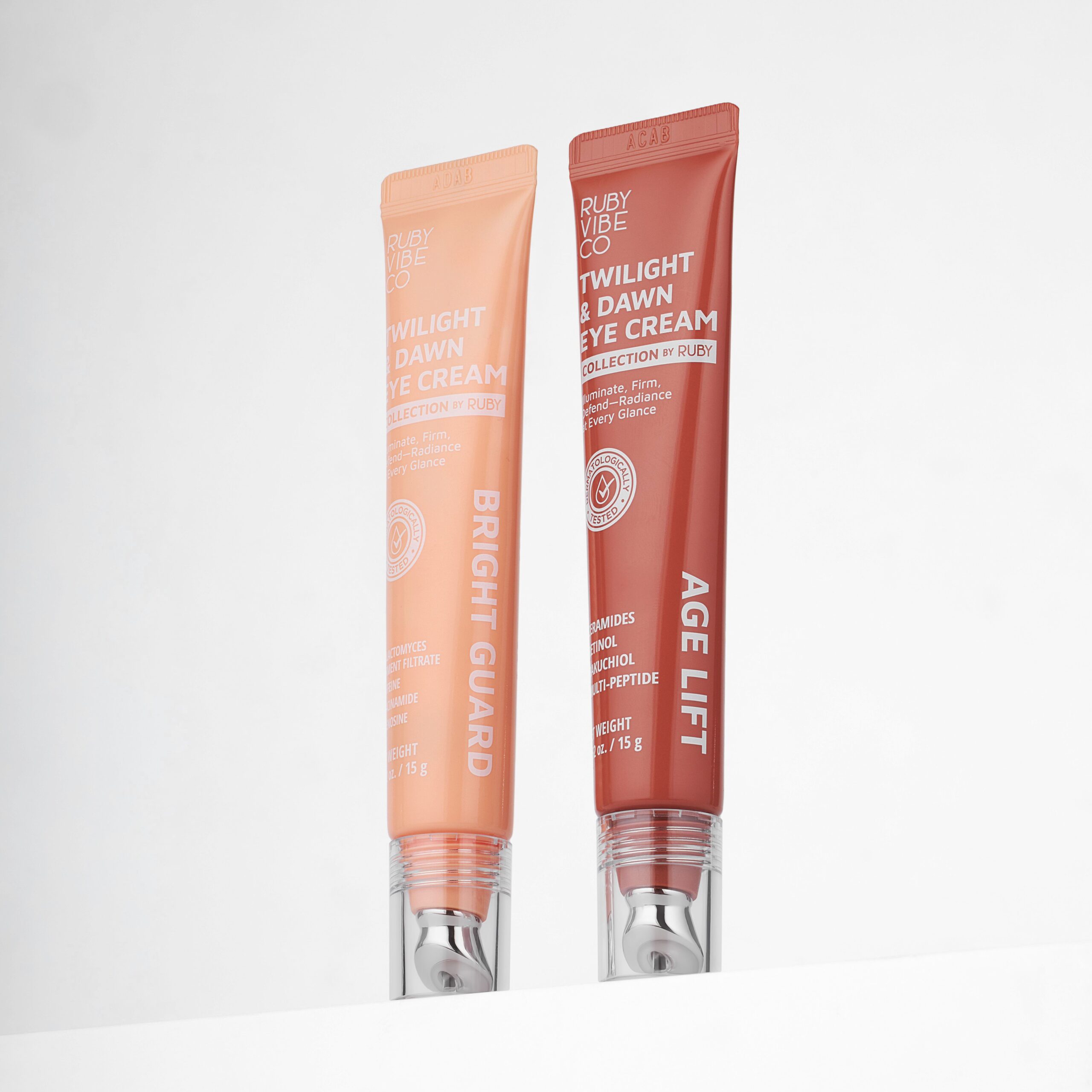 A product shot of two eye creams for day and night use, representing skincare products that help reduce the appearance of dark circles and brighten the under-eye area.